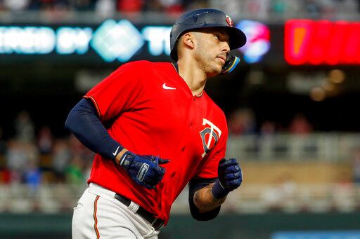 Minnesota Twins' Carlos Correa runs the bases on his solo home run against the Kansas City Royals in the fourth inning of a baseball game Friday, May 27, 2022, in Minneapolis. (AP Photo/Bruce Kluckhohn)