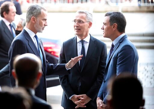 Spain's King Felipe VI speaks with NATO Secretary General Jens Stoltenberg, centre, and Spanish Prime Minister Pedro S&aacute;nchez, right, as they attend a gala at Madrid's Royal Theater, Monday, May 30, 2022. Stoltenberg visits Madrid for Spain's celebration of its 40th year as part of the military alliance one month before the capital hosts an important NATO summit. (Alejandro Mart&iacute;nez/Europa Press via AP, Pool)