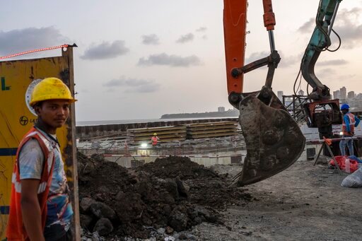 Workers are engaged in the construction of a coastal road in Mumbai, India, Tuesday, May 31, 2022. India&rsquo;s economic growth, hit by pandemic curbs and price increases, slowed to 4.1% in the January-March quarter, according to figures released Tuesday by the government. (AP Photo/Rafiq Maqbool)