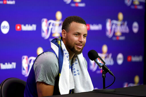 Golden State Warriors guard Stephen Curry speaks to members of the media during NBA basketball practice in San Francisco, Wednesday, June 1, 2022. The Warriors are scheduled to host the Boston Celtics in Game 1 of the NBA Finals on Thursday. (AP Photo/Jed Jacobsohn)