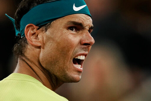 Spain's Rafael Nadal reacts after missing a point as he plays Serbia's Novak Djokovic during their quarterfinal match of the French Open tennis tournament at the Roland Garros stadium Tuesday, May 31, 2022 in Paris. (AP Photo/Thibault Camus)