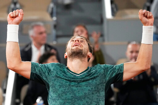 Norway's Casper Ruud celebrates after defeating Croatia's Marin Cilic during their semifinal of the French Open tennis tournament at the Roland Garros stadium Friday, June 3, 2022 in Paris. Ruud won 3-6, 6-4, 6-2, 6-2. (AP Photo/Michel Euler)