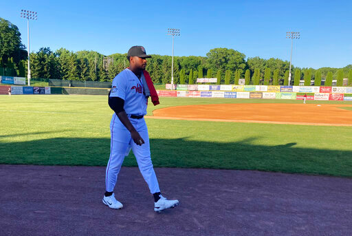 Former Vanderbilt star right-hander Kumar Rocker walks in from the bullpen at Joseph L. Bruno Stadium in Troy, N.Y., Saturday, June 4, 2022, prior to his first start for the Tri-City ValleyCats of the Class A independent Frontier League. Rucker was the 10th pick in last year&rsquo;s MLB draft by the New York Mets but did not sign a contract when the Mets had concerns about his pitching arm. Rocker signed a contract with Tri-City that goes until about two weeks before the next MLB draft in July. (AP Photo/John Kekis)