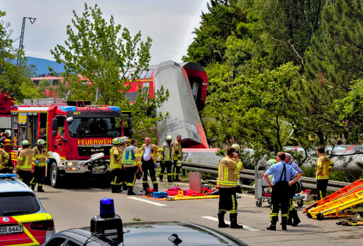 Numerous emergency and rescue forces are in action after a serious train accident in Garmisch-Partenkirchen, Germany, Friday, June 3, 2022. According to the authorities, at least three people have been killed and many injured. (Josef Hornsteiner/dpa via AP)