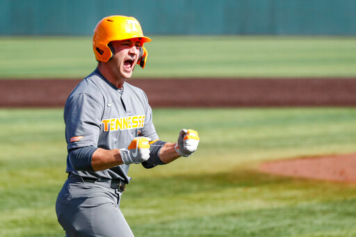 FILE -Tennessee outfielder Evan Russell (6) reacts to hitting a home run during an NCAA college baseball super regional game against LSU Sunday, June 13, 2021, in Knoxville, Tenn. Tennessee's Evan Russell has been cleared to play in an NCAA Tournament regional game against Campbell on Saturday, June 4, 2022 and the school said it expects an apology from ESPN after one of its announcers said the catcher had failed a test for performance enhancing drugs.(AP Photo/Wade Payne, File)