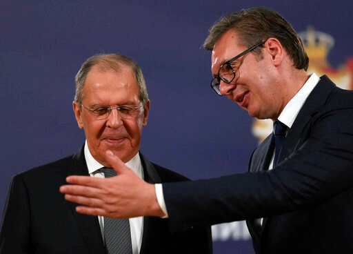 FILE - Russian Foreign Minister Sergey Lavrov, left, speaks with Serbia's President Aleksandar Vucic after a press conference in Belgrade, Serbia, Sunday, Oct. 10, 2021. Serbia says that a planned visit Monday, June 6, 2022 by Russia&rsquo;s foreign minister to the Balkan country will not take place. The announcement followed reports that Serbia&rsquo;s neighbors, Bulgaria, North Macedonia and Montenegro refused to allow Sergey Lavrov&rsquo;s plane to fly through their airspace to reach Serbia.  (AP Photo/Darko Vojinovic, File)