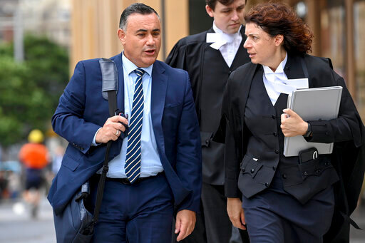 Former New South Wales Deputy Premier John Barilaro, left, arrives at the The Federal Court of Australia in Sydney on March 23, 2022. An Australian court on Monday ordered Google to pay a former politician 715,000 Australian dollars ($515,000) over two defamatory YouTube videos. (Bianca De Marchi/AAP Image via AP)