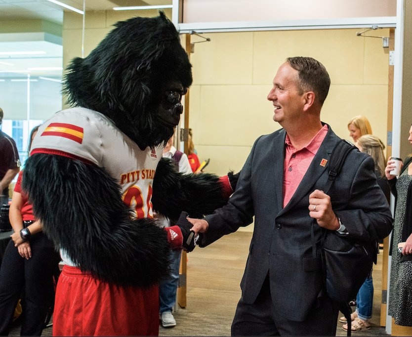 Pittsburg State&rsquo;s new president, Dr. Daniel Shipp, is greeted by Gus as he arrives for his first day of work.