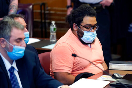 FILE &mdash; Richard Rojas, right, appears in court for the start of his trial in New York, Monday, May 9, 2022. Rojas, 31, is fighting murder, assault and other charges at a trial unfolding in the shadow of mass shootings across the country and the political debate in which gun-control opponents have sought to blame the violence on failures in mental health care. (AP Photo/Seth Wenig, File)