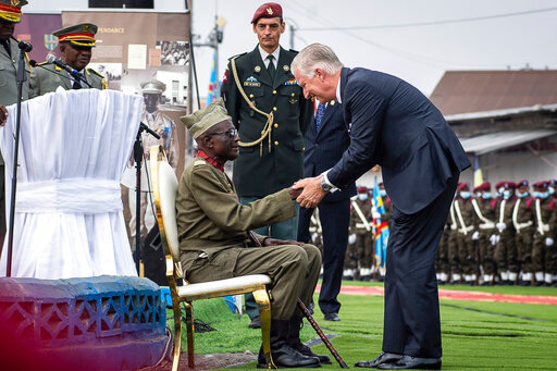 King Philippe of Belgium, right, greets 100-year-old corporal Albert Kunyuku, the last surviving Congolese veteran of World War II during a ceremony at the Veterans Memorial in Kinshasa, Democratic Republic of the Congo, Wednesday June 8, 2022. King Philippe is on the second day of his six-day visit. (AP Photo/Samy Ntumba Shambuyi)