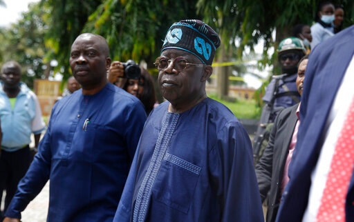 Bola Tinubu, centre , pays a visit at the St Francis Catholic Church following a gunmen attacked in Owo, Nigeria, Monday, June 6, 2022.  A former governor of Lagos, Nigeria&rsquo;s largest city, has been nominated to be the ruling party&rsquo;s presidential candidate in next year&rsquo;s presidential election. Bola Tinubu, widely referred to as the &ldquo;godfather&rdquo; of Lagos because of his influence in the southwestern state which he governed from 1999 to 2007, polled a majority of the votes on Wednesday at the convention of the All Progressives Congress party. (AP Photo/Sunday Alamba)
