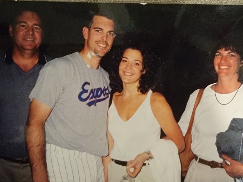 Dan Smith is joined by his dad Dan, wife Jennifer and mom Debbie after he won in his major league debut with the Montreal Expos on June 8, 1999. Notice the bits of shaving cream left over after he took a pie to the face.