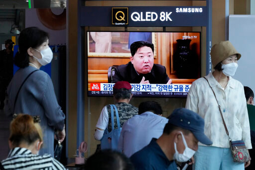 People watch a TV showing an image of North Korea leader Kim Jong Un during a news program at the Seoul Railway Station in Seoul, South Korea, Monday, June 13, 2022. Kim and his top deputies have pushed for a crackdown on officials who abuse their power and commit other &quot;unsound and non-revolutionary acts,&quot; state media reported Monday, as Kim seeks greater internal unity to overcome a COVID-19 outbreak and economic difficulties. (AP Photo/Ahn Young-joon)