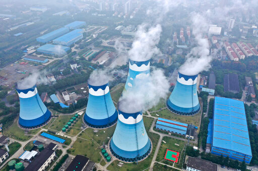 FILE - In this Sept. 27, 2021 file photo, steam billows out of the cooling towers at a coal-fired power station in Nanjing in east China's Jiangsu province. An independent research group says China has overtaken Germany as the biggest buyer of Russian energy exports since the start of the war in Ukraine. The Centre for Research on Energy and Clean Air said Monday, June 13, 2022 that Russia received about 93 billion euros in revenue from the sale of oil, natural gas and coal since the Feb. 24 invasion. (Chinatopix via AP, File)