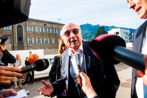 The former president of the World Football Association (FIFA), Joseph Blatter, speaks as he arrives at the Swiss Federal Criminal Court in Bellinzona, Switzerland, Wednesday, June 8, 2022. Blatter and the former president of the the European Football Association (UEFA), Michel Platini, will stand trial before the Federal Criminal Court from Wednesday, over a suspicious two-million payment. (Alessandro Crinari/Keystone via AP)
