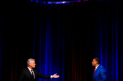 Mike Collins, left, and Vernon Jones participate in Georgia's 10th Congressional District republican primary election runoff debates on Monday, June 6, 2022, in Atlanta. (AP Photo/Brynn Anderson)