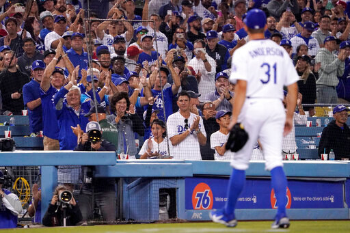 Fan cheer for Los Angeles Dodgers starting pitcher Tyler Anderson after he was taken out of the game after Anderson gave up a triple to Los Angeles Angels' Shohei Ohtani during the ninth inning of a baseball game Wednesday, June 15, 2022, in Los Angeles. Anderson had a no-hitter going until that point. (AP Photo/Mark J. Terrill)