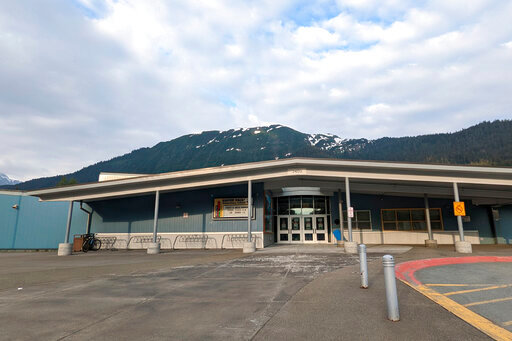 The Glacier Valley Elementary School is seen in Juneau, Alaska, on Tuesday, June 14, 2022. A dozen students and two adults were served floor sealant instead of milk at the school after containers were apparently mixed up, the superintendent said Wednesday. Several children complained of burning sensations in their mouth and throats, and at least one child was treated at the local hospital after the Tuesday morning mix-up, Superintendent Bridget Weiss said. (Ben Hohenstatt/The Juneau Empire via AP)