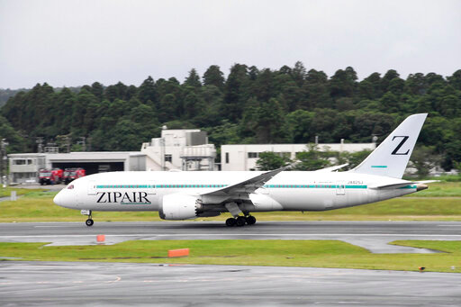 This photo shows an airplane of Japanese low-cost carrier Zipair at Narita Airport in Narita, near Tokyo June 15, 2022. The carrier is changing the design on its tail from the letter &quot;Z,&quot; which resembles the symbol on Russian tanks. (Kyodo News via AP)