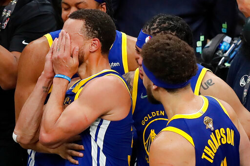 Golden State Warriors guard Stephen Curry reacts after the Warriors defeated the Boston Celtics in Game 6 of basketball's NBA Finals, Thursday, June 16, 2022, in Boston. (AP Photo/Michael Dwyer)