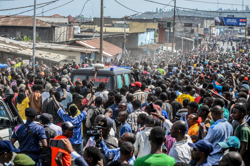 Residents fill the streets as they follow an ambulance containing the dead body of a Congolese soldier, in Goma, eastern Congo Friday, June 17, 2022. Rwanda's military says a Congolese soldier crossed the border and began shooting at Rwandan security forces and civilians before being shot dead Friday morning, the latest escalation in tensions between the countries. (AP Photo/Moses Sawasawa)