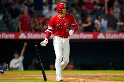 Los Angeles Angels designated hitter Shohei Ohtani (17) runs the bases after hitting a home run during the sixth inning of a baseball game against the Kansas City Royals in Anaheim, Calif., Tuesday, June 21, 2022. Taylor Ward and Mike Trout also scored. (AP Photo/Ashley Landis)