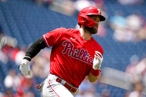 Philadelphia Phillies designated hitter Bryce Harper singles in the third inning of the first game of a baseball doubleheader against the Washington Nationals, Friday, June 17, 2022, in Washington. (AP Photo/Patrick Semansky)