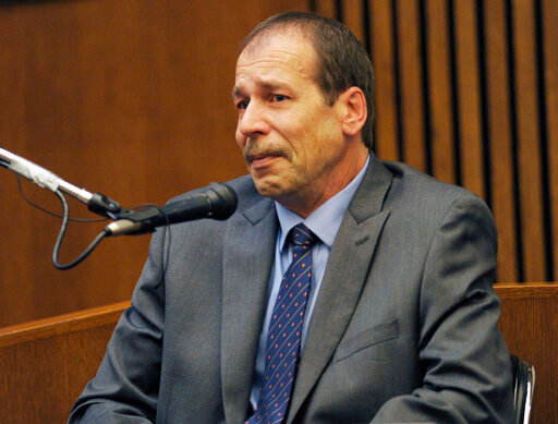FILE - Ted Wafer, of Dearborn Heights, Mich., testifies in his own defense during his second degree murder trial in Detroit on Aug. 4, 2014. Wafer, who said he feared for his life when he fatally shot a young woman on his porch in 2013, was given the same 17-year prison sentence Wednesday, June 22, 2022, at a new hearing ordered by the Michigan Supreme Court. (Clarence Tabb Jr./Detroit News via AP, File)