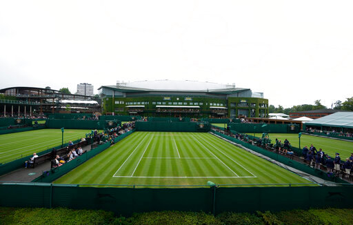 FILE -The outside courts in front of Centre Court are shown on day one of the Wimbledon Tennis Championships in London, Monday June 28, 2021. How much do you know about Wimbledon? (AP Photo/Kirsty Wigglesworth, File)