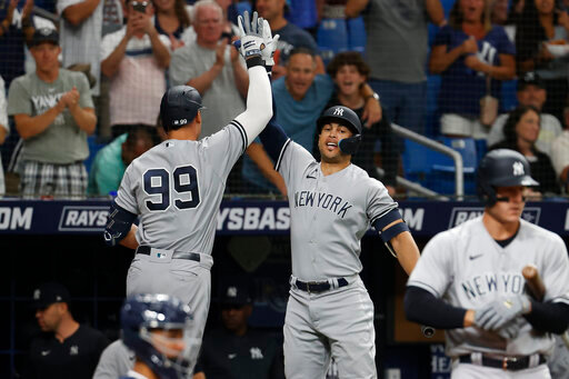 New York Yankees' Aaron Judge, left, celebrates with Giancarlo Stanton after hitting a home run against the Tampa Bay Rays during the fourth inning of a baseball game Wednesday, June 22, 2022, in St. Petersburg, Fla. (AP Photo/Scott Audette)