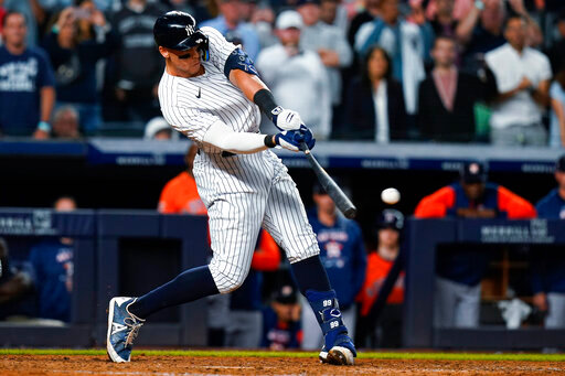 New York Yankees' Aaron Judge hits a single to drive in the winning run during the ninth inning of the team's baseball game against the Houston Astros on Thursday, June 23, 2022, in New York. The Yankees won 7-6. (AP Photo/Frank Franklin II)