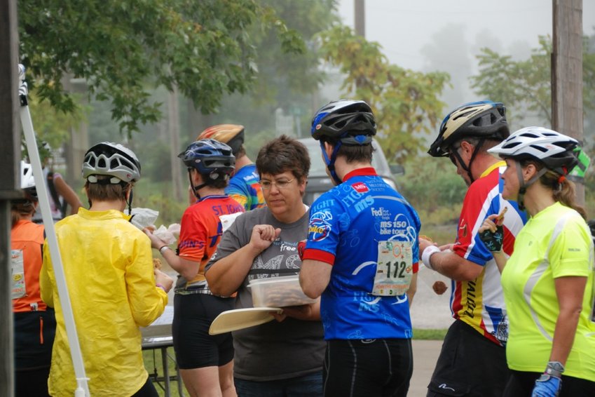 Volunteer Gina Peak passes out homemade cookies to people participating in the Bike the US for MS event in 2009. This year the group of riders will arrive in Pittsburg on June 26.