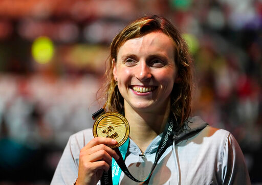 Gold medalist Katie Ledecky of the United States poses with her medal after the Women 800m Freestyle final at the 19th FINA World Championships in Budapest, Hungary, Friday, June 24, 2022. (AP Photo/Petr David Josek)