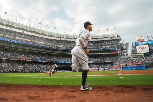 New York Yankees' Aaron Judge takes the field for the team's baseball game against the Houston Astros, Friday, June 24, 2022, in New York. Judge and the Yankees agreed to a $19 million, one-year contract, avoiding an arbitration hearing. (AP Photo/Bebeto Matthews)