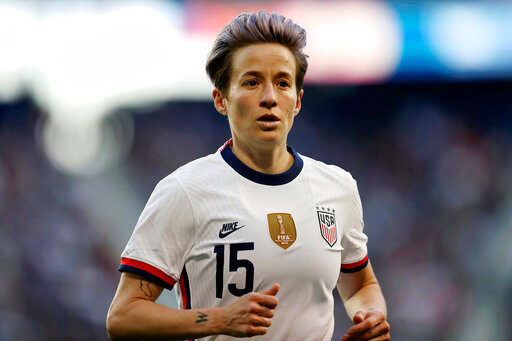FILE -  o, U.S. forward Megan Rapinoe runs during the second half of a SheBelieves Cup soccer match against Spain on March 8, 2020, in Harrison, N.J. Rapinoe says she could not hide her anger over the Supreme Court's decision to overturn the abortion rights provisions of Roe v. Wade, decrying an erosion of rights that women have had for a generation. (AP Photo/Steve Luciano, File)