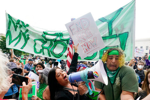 People protest about abortion, Friday, June 24, 2022, outside the Supreme Court in Washington. (AP Photo/Steve Helber)