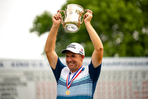 Padraig Harrington holds the Francis D. Ouimet Memorial Trophy after winning the U.S. Senior Open golf championship Sunday, June 26, 2022, at Saucon Valley Country Club in Bethlehem, Pa. (Joseph Scheller/The Morning Call via AP)