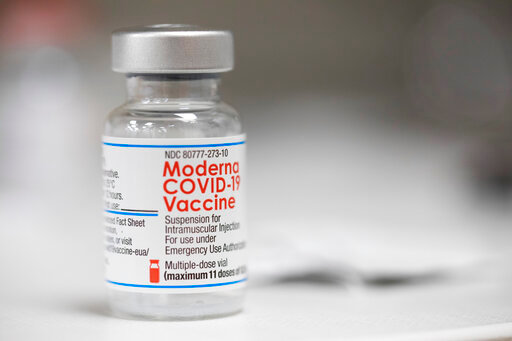 FILE - A vial of the Moderna COVID-19 vaccine is displayed on a counter at a pharmacy in Portland, Ore. on Dec. 27, 2021. U.S. health authorities are facing a critical decision: whether to offer COVID-19 booster shots this fall that better match the omicron variant even though the coronavirus already has spawned still more mutants. Moderna and Pfizer are testing updated booster candidates, and advisers to the U.S. Food and Drug Administration will debate Tuesday, June 28, 2022, if it&rsquo;s time for a switch, setting the stage for similar moves by other countries. (AP Photo/Jenny Kane, File)