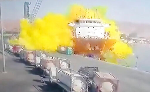 This photo taken from CCTV video broadcasted by Al-Mamlaka TV shows a chlorine gas explosion after it fell off a crane in the port of Aqaba, Jordan, Monday, June 27, 2022. Some dozen workers were killed and scores were hospitalized. (Al-Mamlaka TV via AP)