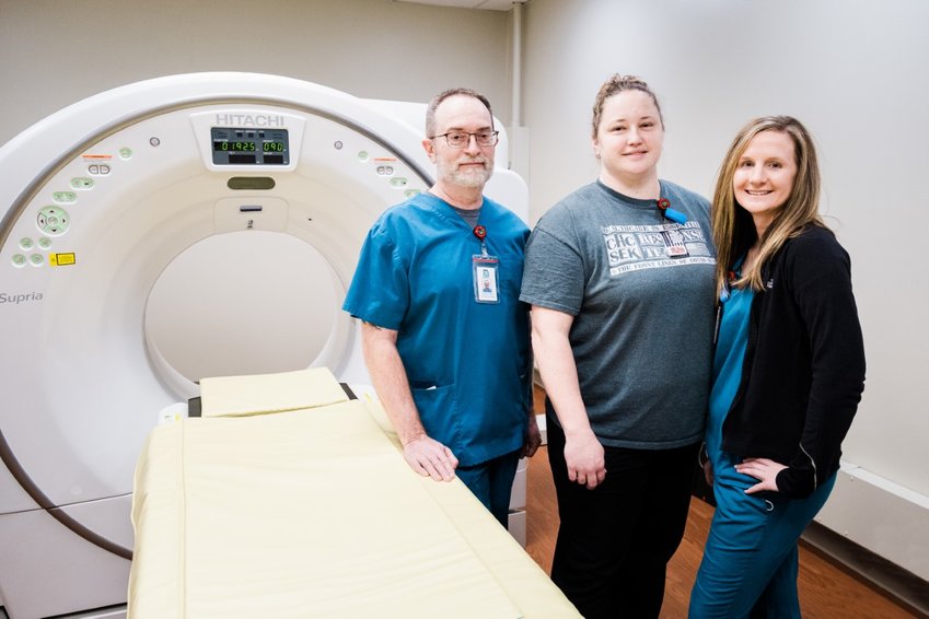 CT/X-ray Technologists Joe Tomasi, Kimberly Wass, and Kelsey McKinney are pictured here with a CT scanner at the Pittsburg North clinic located at 3011 N. Michigan.