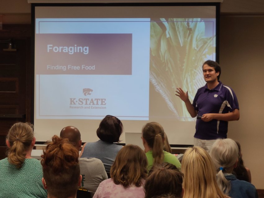 Wildcat Extension Agent and Horticulturist Jesse Gilmore gives the audience advice on how to forage food in nature at the Pittsburg Public Library on Tuesday.