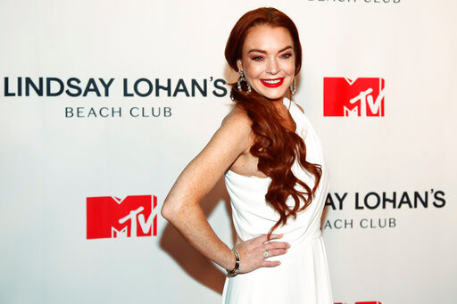 FILE - Lindsay Lohan attends MTV's &quot;Lindsay Lohan's Beach Club&quot; series premiere party at Magic Hour Rooftop at The Moxy Times Square on Jan. 7, 2019, in New York. Lohan is celebrating her 36th birthday on Saturday as a married woman. The &ldquo;Freaky Friday&rdquo; star said she was the &ldquo;luckiest woman in the world&rdquo; in an Instagram post Friday, July 1, 2022, that pictured her with financier Bader Shammas, who had been her fiance. (Photo by Andy Kropa/Invision/AP, File)
