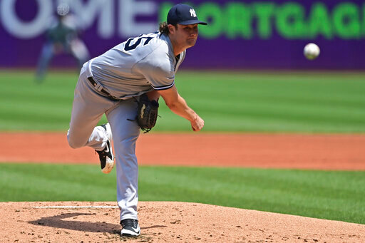 New York Yankees starting pitcher Gerrit Cole delivers in the first baseball game of a doubleheader against the Cleveland Guardians, Saturday, July 1, 2022, in Cleveland. (AP Photo/David Dermer)