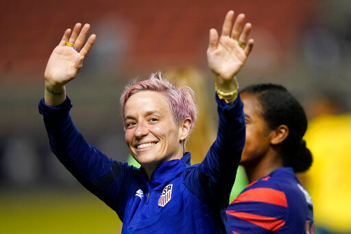 FILE - Megan Rapinoe waves to fans following the team's international friendly soccer match against Colombia, June 28, 2022, in Sandy, Utah. President Joe Biden will present the nation&rsquo;s highest civilian honor, the Presidential Medal of Freedom, to 17 people, at the White House next week. (AP Photo/Rick Bowmer, File)