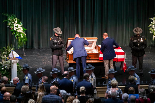 Officers close the casket for Floyd County Deputy William Petry at the Mountain Arts Center in Prestonsburg, Ky., Tuesday, July 5, 2022. Dep. Petry was killed when a man with a rifle opened fire on police attempting to serve a warrant Thursday, June 30. (Silas Walker/Lexington Herald-Leader via AP)
