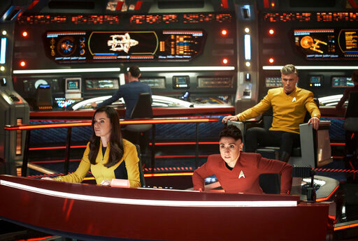 This image released by Paramount+ shows, from left, Rebecca Romijn as Una, Ethan Peck as Spock, background, Melissa Navia as Ortegas and Anson Mount as Pike in a scene from the series &quot;Star Trek: Strange New Worlds.&quot; (Marni Grossman/Paramount+ via AP)