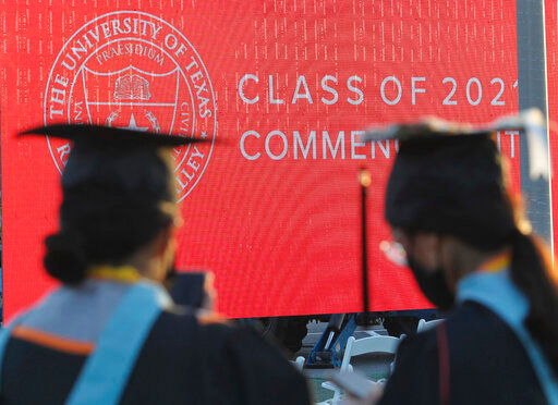 FILE - Graduates of the University of Texas Rio Grande Valley attend their commencement ceremony at the schools parking lot on Friday, May 7, 2021, in Edinburg, Texas.   A deadline is fast approaching for teachers, librarians, nurses and others who work in public service to apply to have their student loan debt forgiven. New figures from the U.S. Department of Education show 145,000 borrowers have had the remainder of their debt canceled through the Public Service Loan Forgiveness program.  (Delcia Lopez/The Monitor via AP, File)
