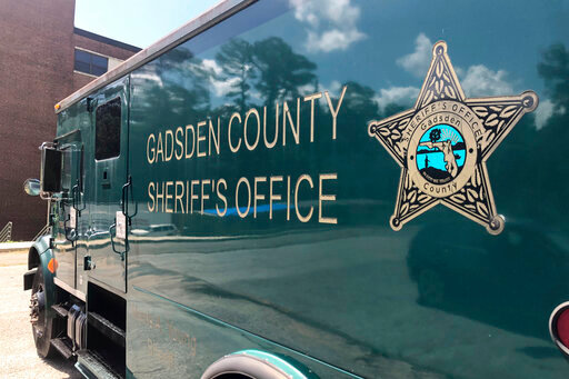 A Gadsden County Sheriff's Office van in parked at their main office, Wednesday, July 6, 2022, in Quincy, Fla. (AP Photo/Anthony Izaguirre)