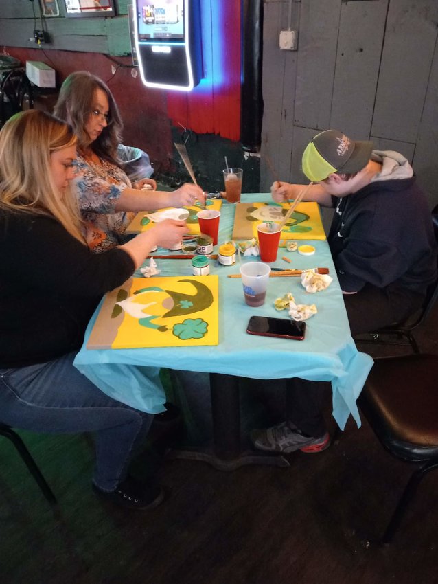 Patrons paint pictures at a previous Paint and Sip event at the 18th Street Pub in Parsons earlier this year.