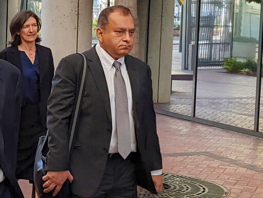 FILE - Ramesh &quot;Sunny&quot; Balwani, right, the former lover and business partner of Theranos CEO Elizabeth Holmes, walks into federal court in San Jose, Calif., Friday, June 24, 2022.  Balwani was found guilty in Theranos blood-testing fraud case, Thursday, July 7. .(AP Photo/Michael Liedtke, File)